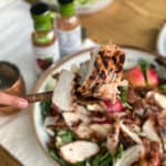 Grilled chicken over fall harvest salad