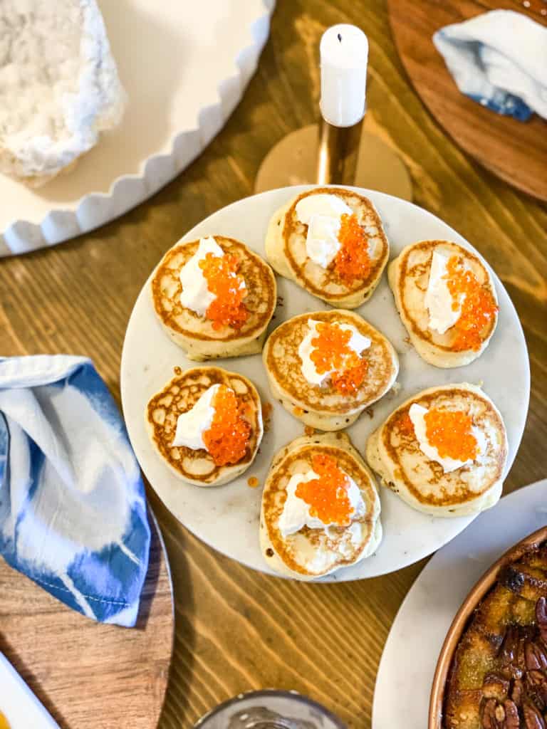 Blinis with caviar on a cake stand