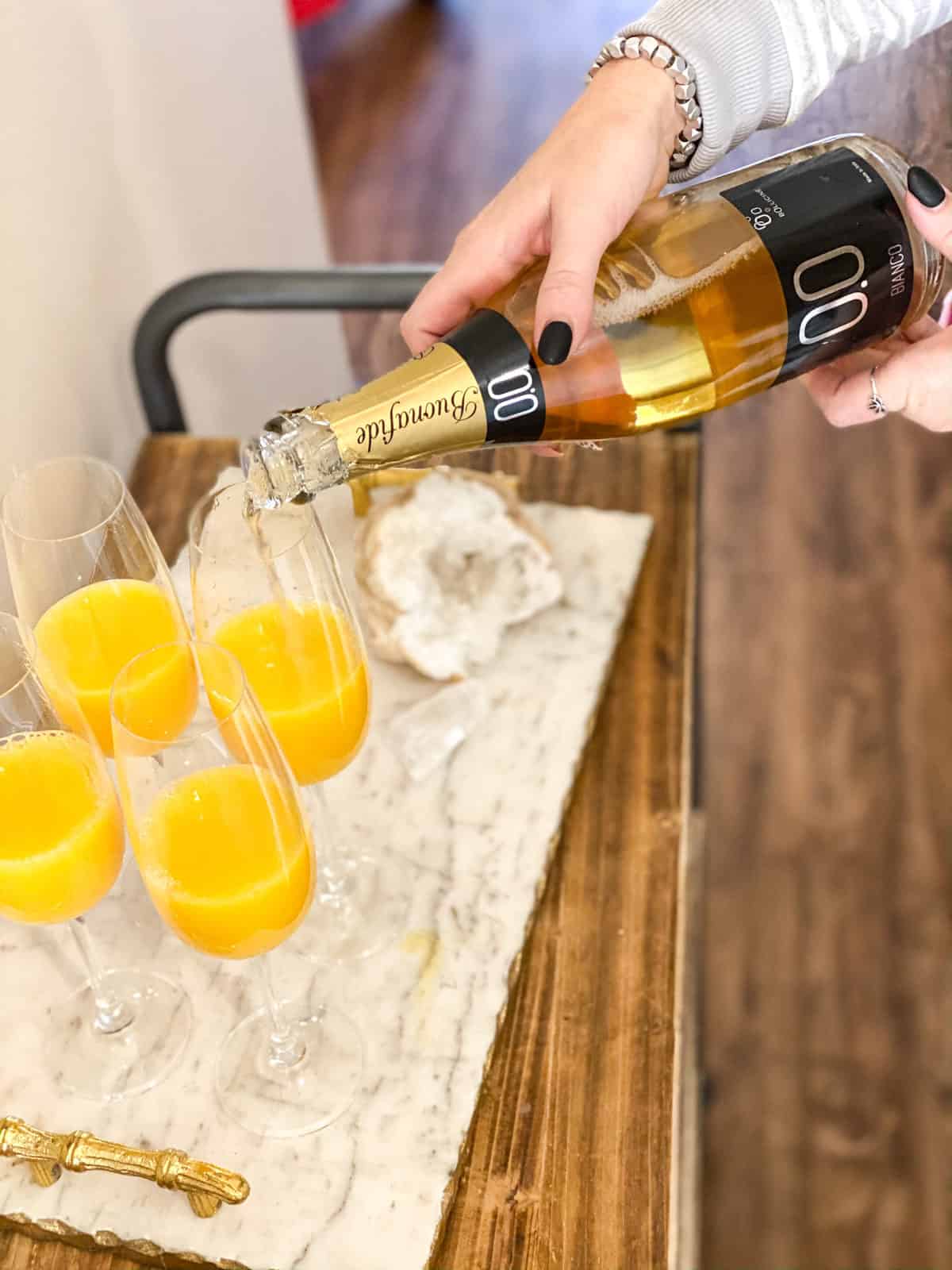 Mimosa mocktails being made