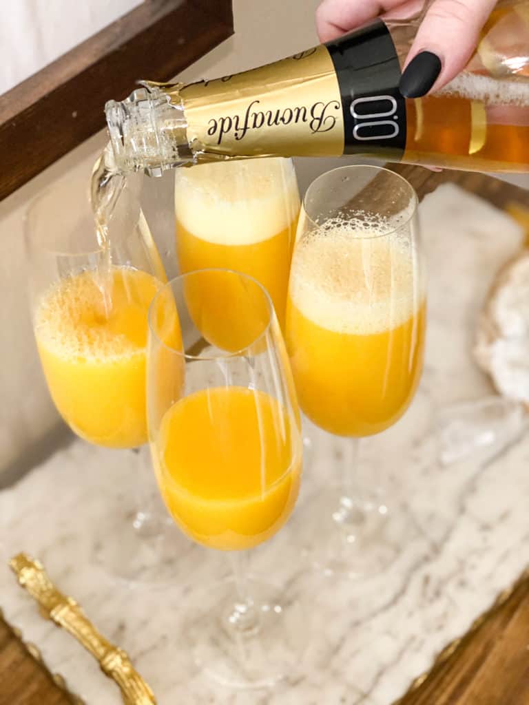 Mimosa Mocktail (Non-Alcoholic) being poured