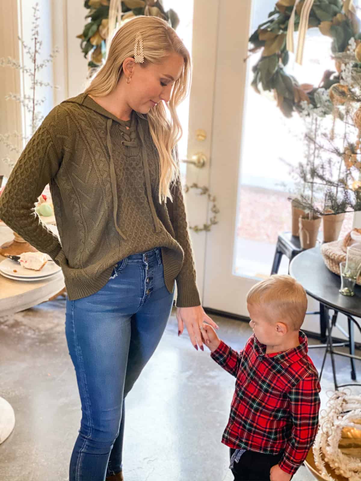 Girl with little boy holding hands