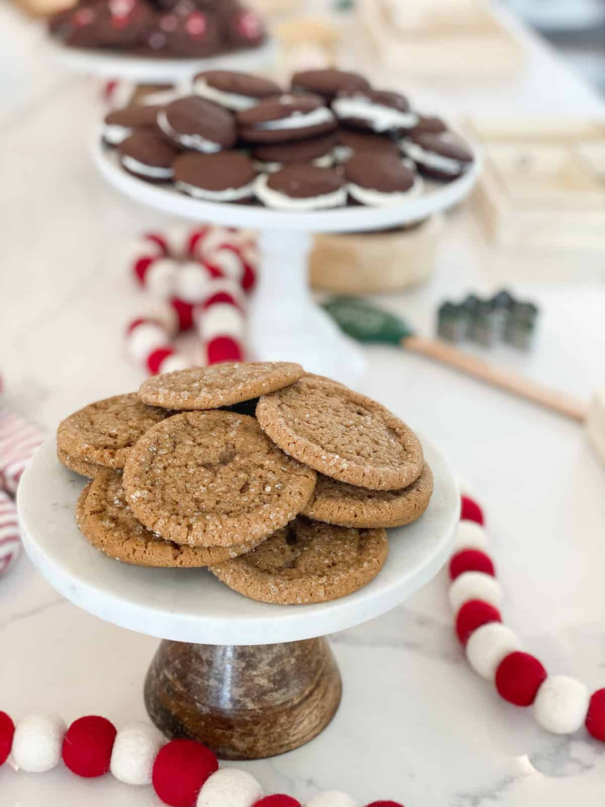 Ginger molasses cookies on a cake stand