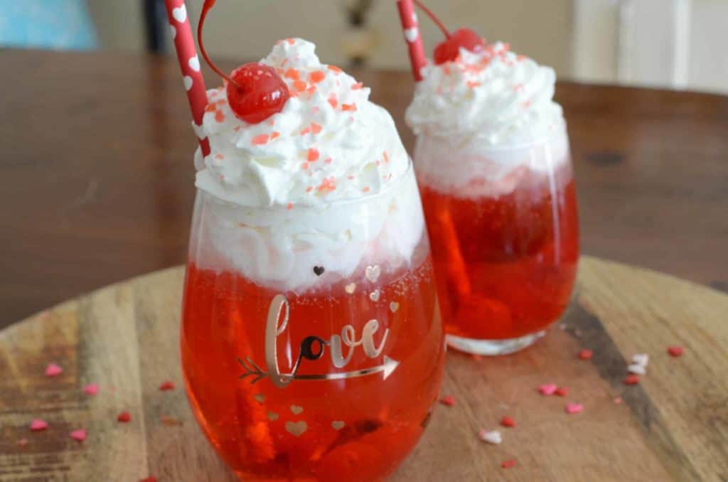 Cupids cocktail red in a cup with whipped cream
