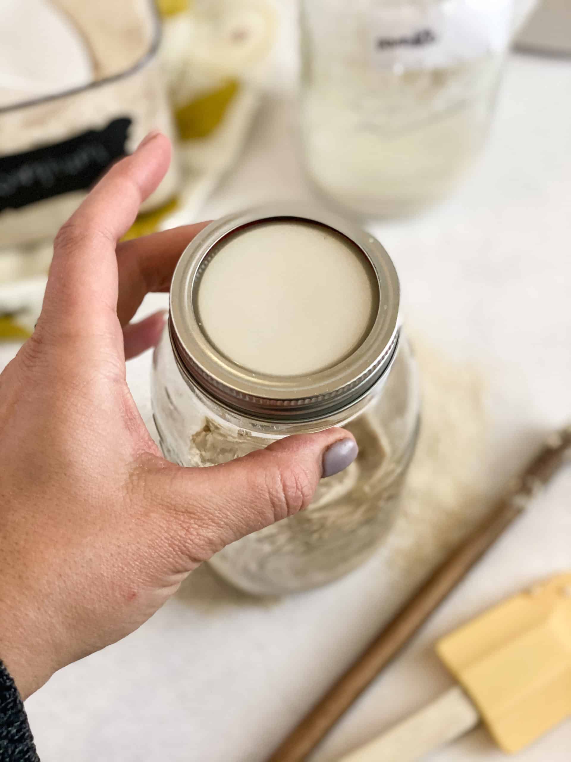 Lid being put on a jar