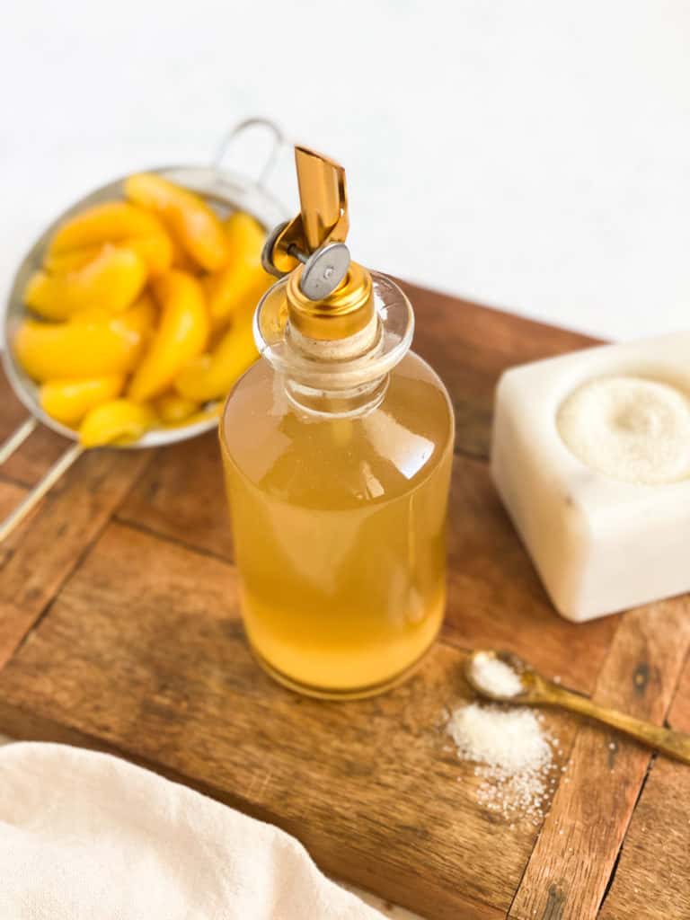 Peach Simple Syrup in a glass jar