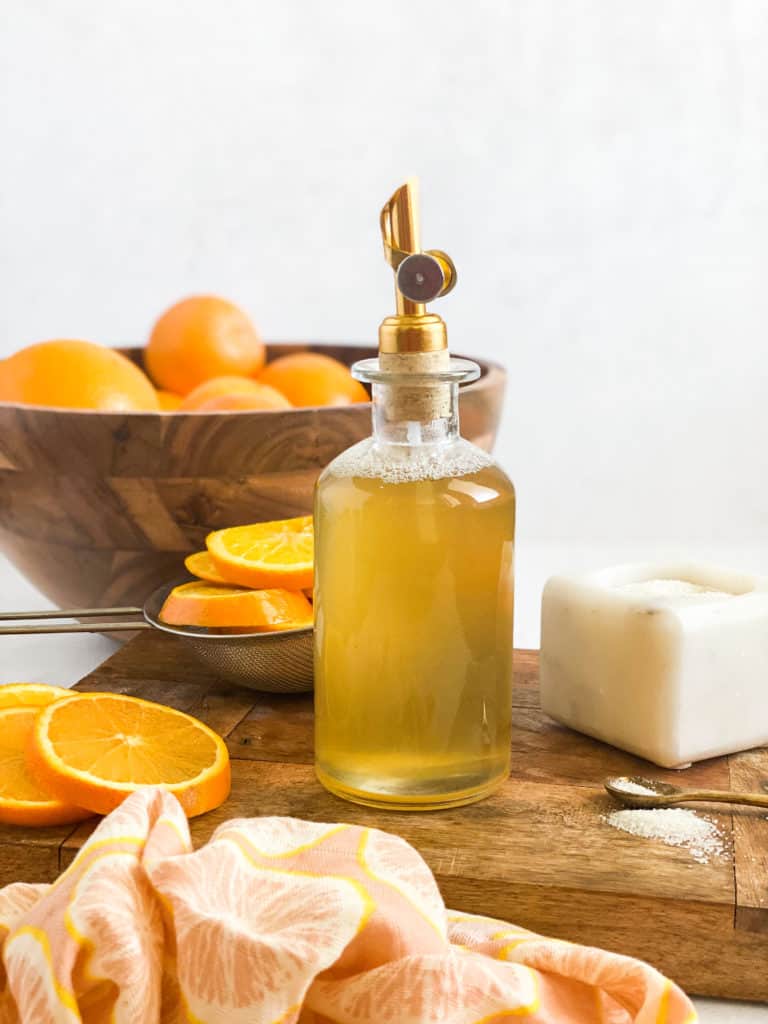 Orange Simple Syrup in a glass jar