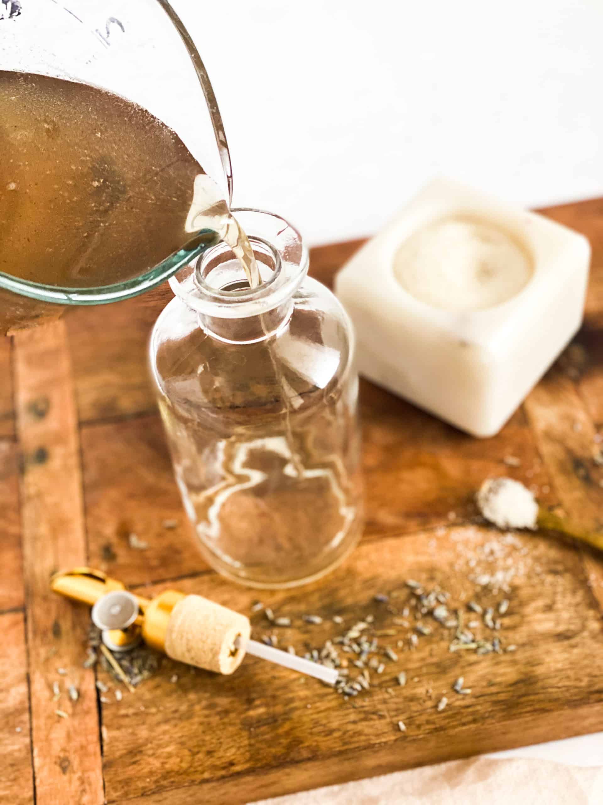 Lavender Simple Syrup being poured into a glass jar