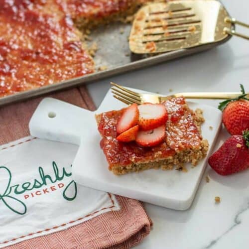 Strawberry baked oats on a platter with jam
