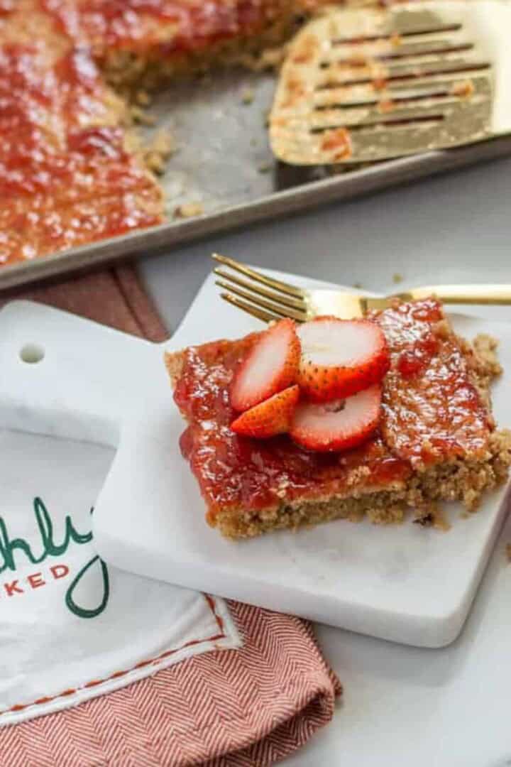 Strawberry baked oats on a platter with jam