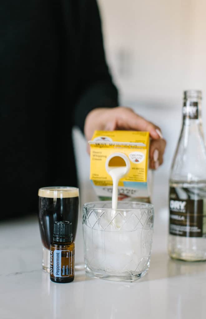 White Russian mocktail cream being poured