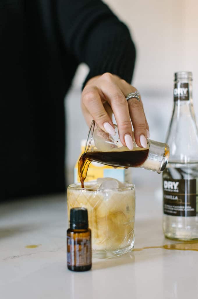 Coffee being poured into White Russian mocktail