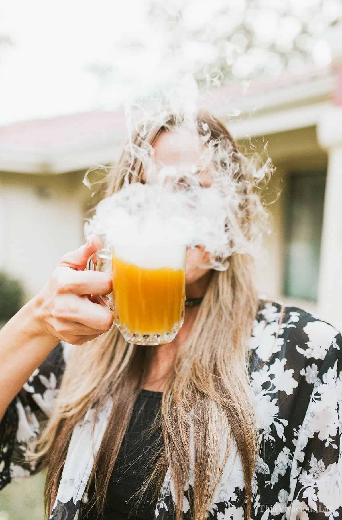 Pumpkin punch in front of a face smoking