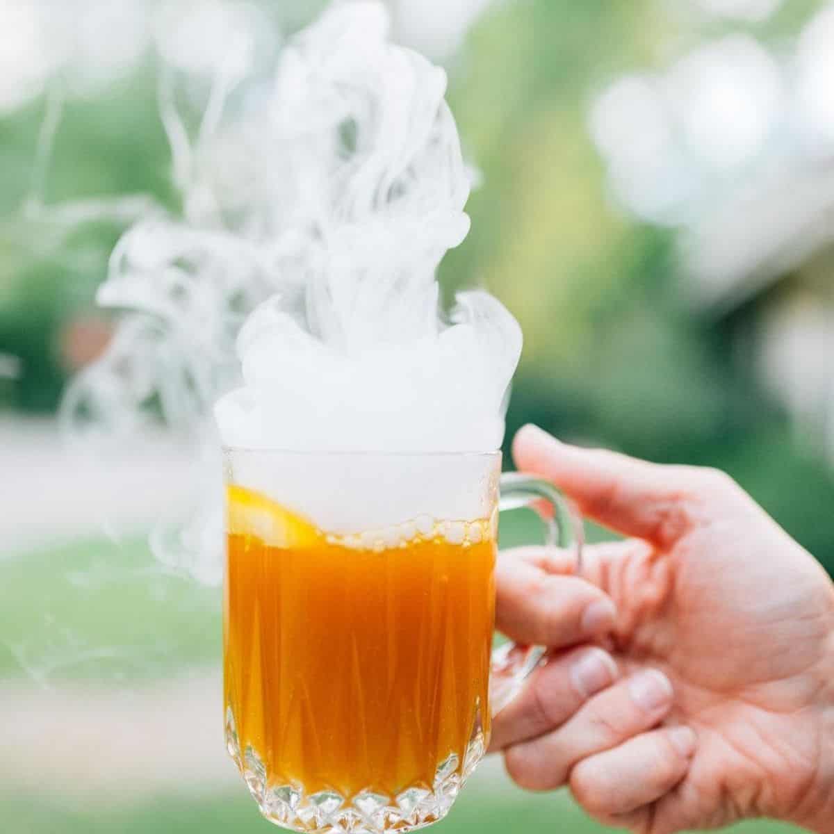 Smoking Halloween Mocktails in a hand
