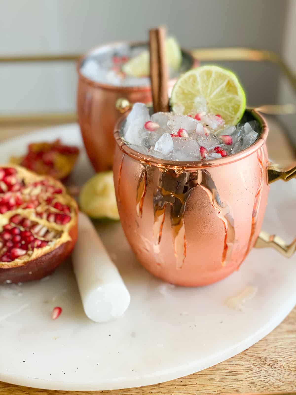 Thanksgiving mocktails in a copper cup with cinnamon sticks