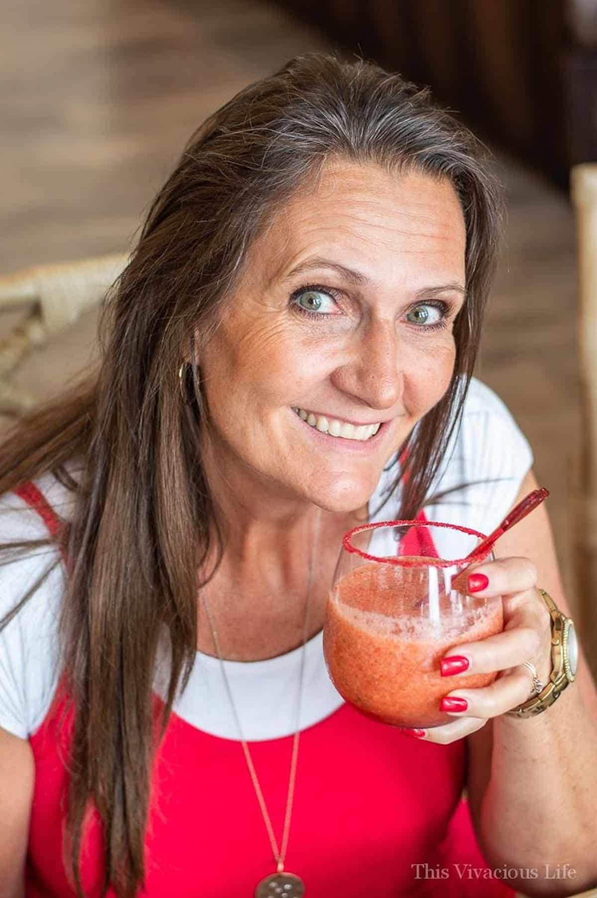 Virgin Strawberry Margarita Mocktail in a woman's hand