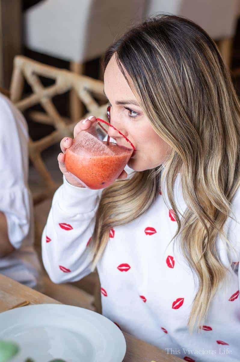 Virgin Strawberry Margarita Mocktail being drunk by a woman
