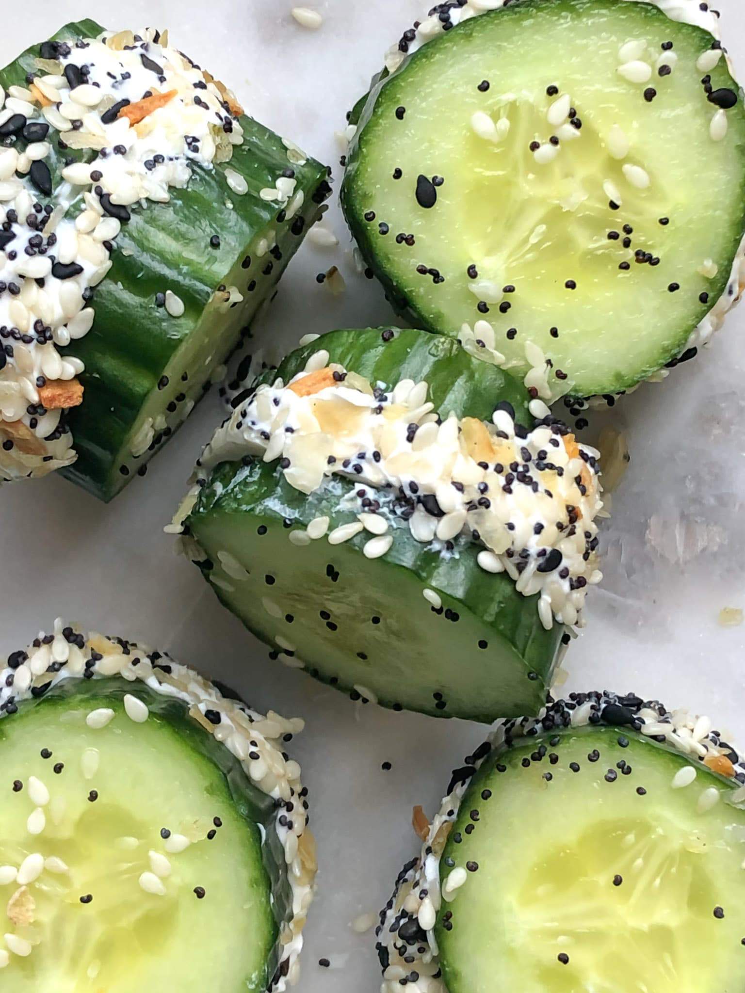 Cucumber discs made into everything bagel sandwiches