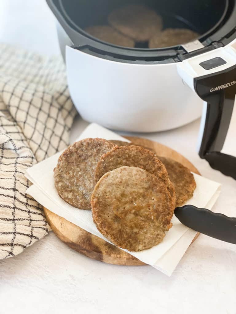 Air Fryer Sausage Patties on a plate with paper towel