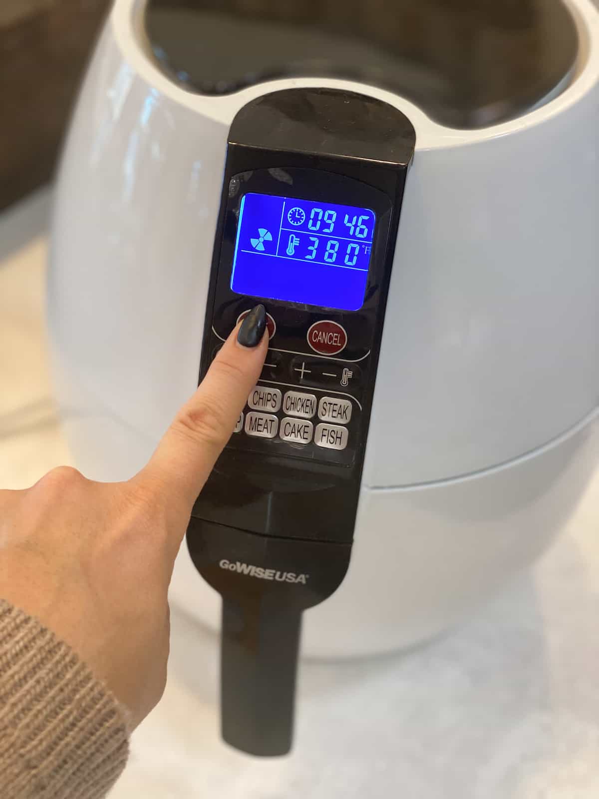 Hash Browns in Air Fryer hand on buttons