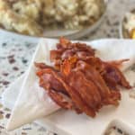 Instant Pot bacon on a white marble tray with napkin