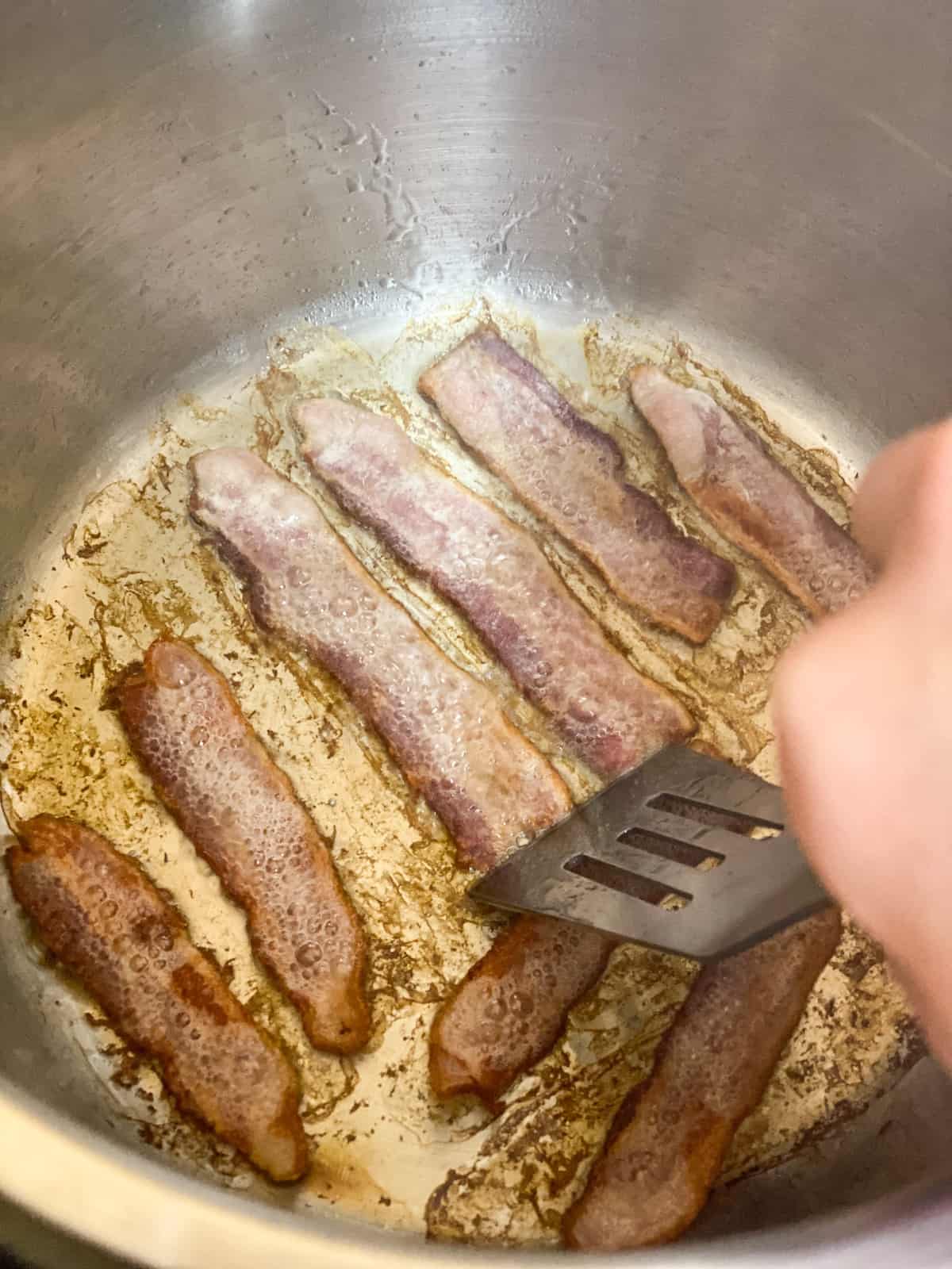 Spatula stirring Instant Pot bacon