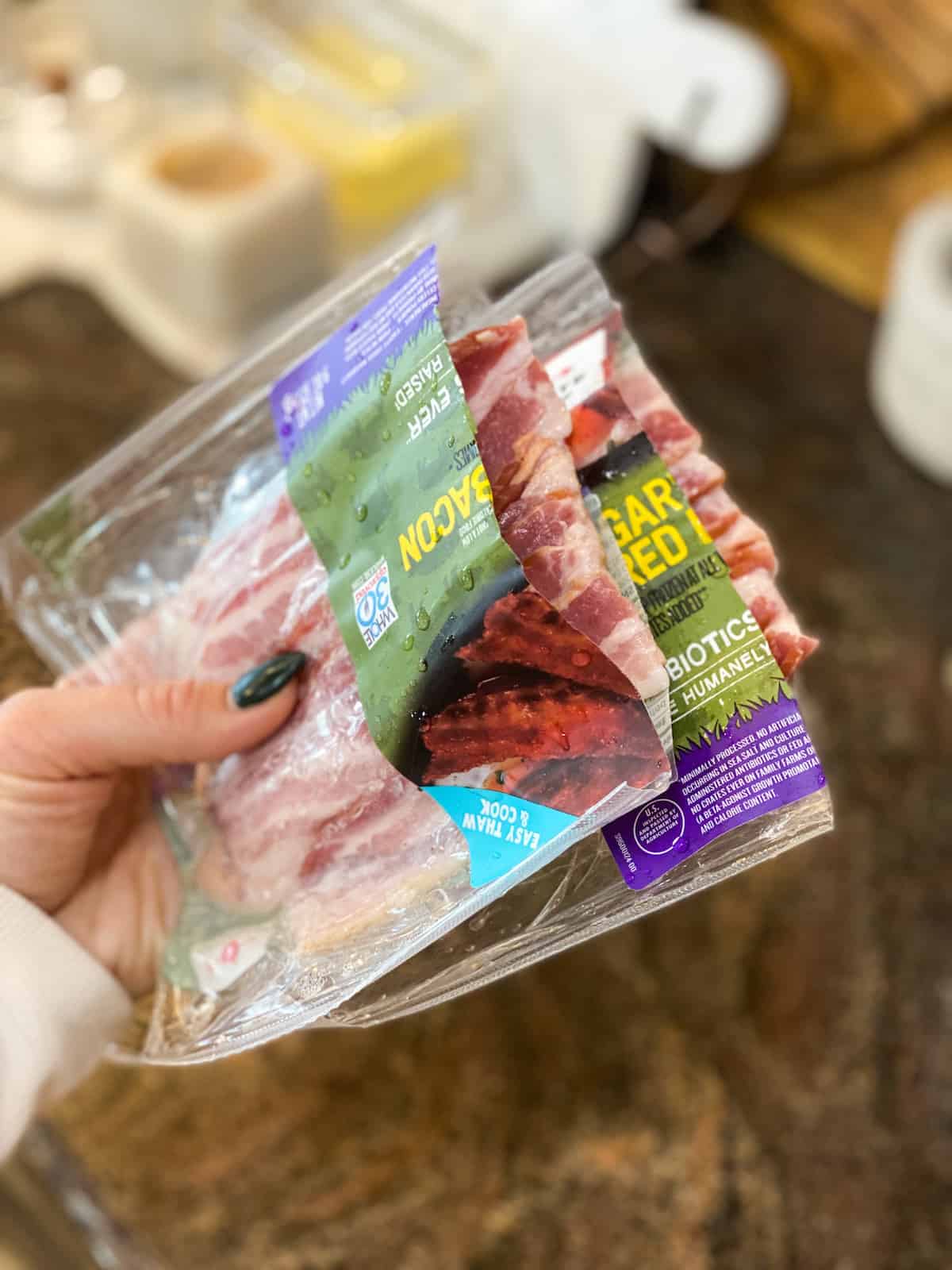 Bacon package opened in a hand
