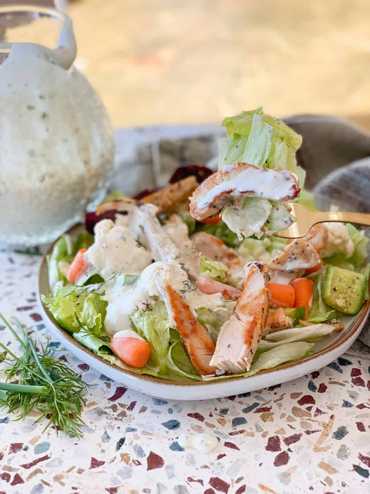 Whole30 Ranch Dressing on a salad with chicken