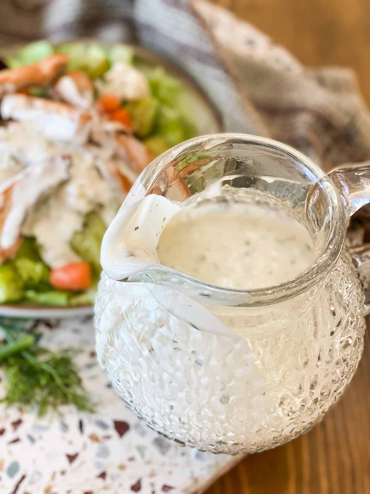 Whole30 Ranch Dressing in a glass pitcher