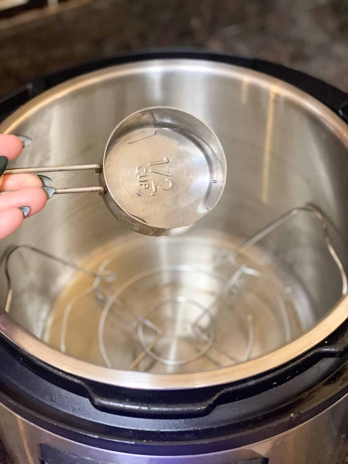 Water being poured into an instant pot
