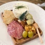 Small Charcuterie Board on a wood board on a white plate