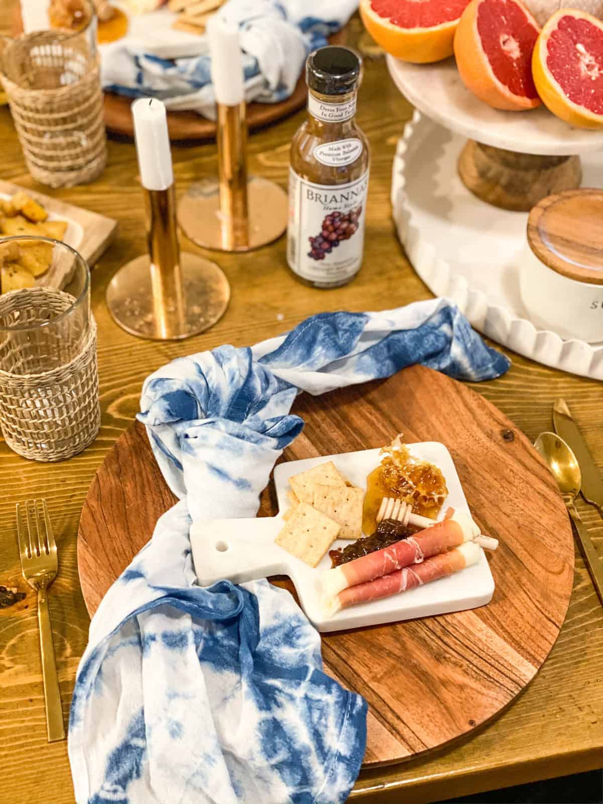 Small Charcuterie Board on a little marble board on a wood plate