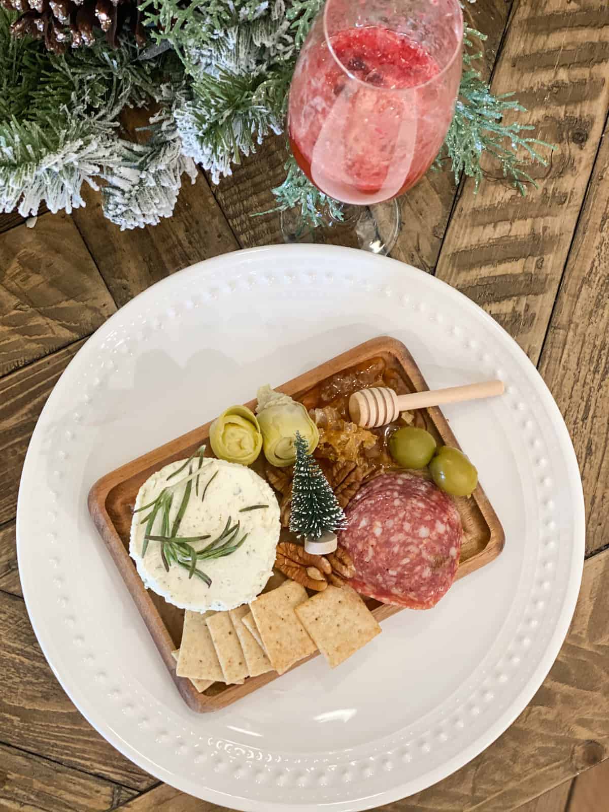 Small Charcuterie Board on a wood board on a white plate