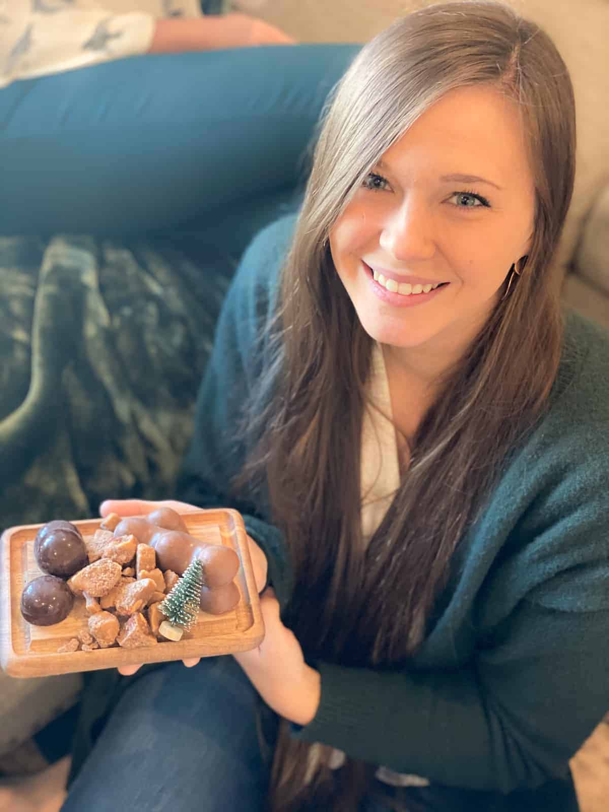 Small Charcuterie Board with chocolate in a girls hand