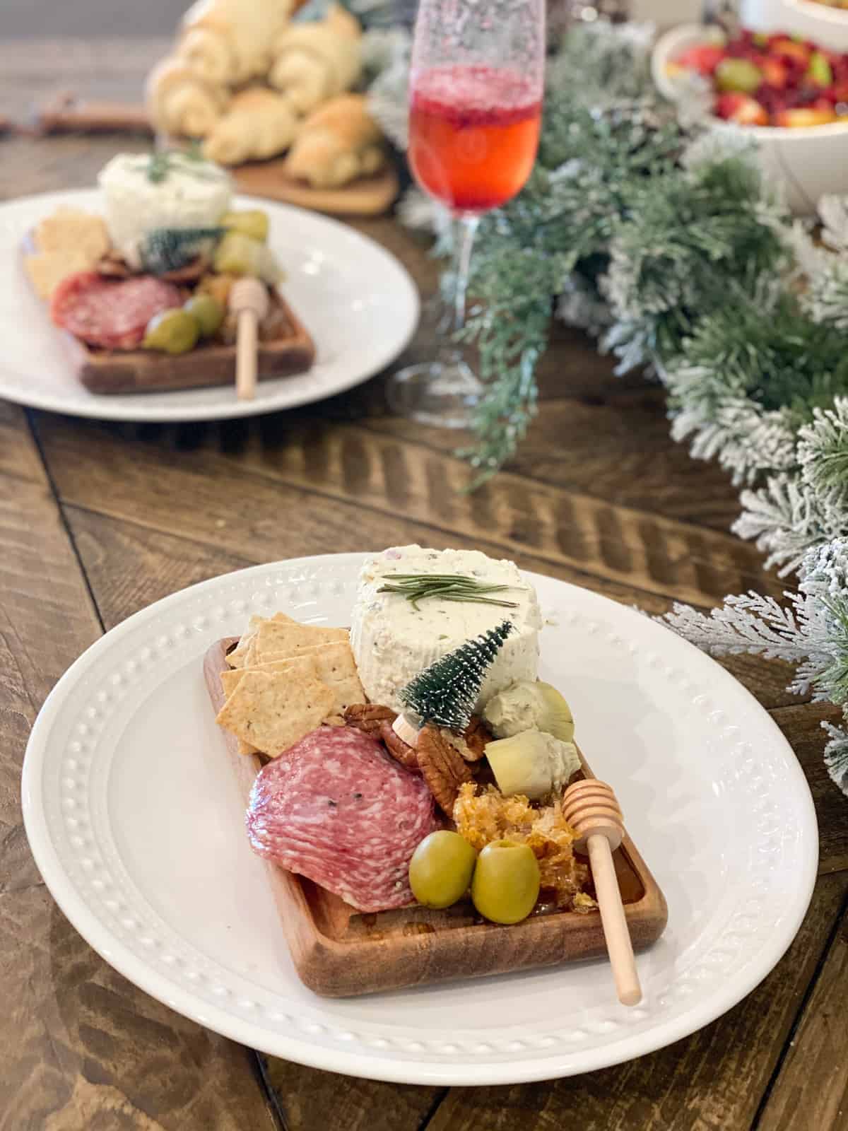 Small Charcuterie Board on a little wood board on a white plate