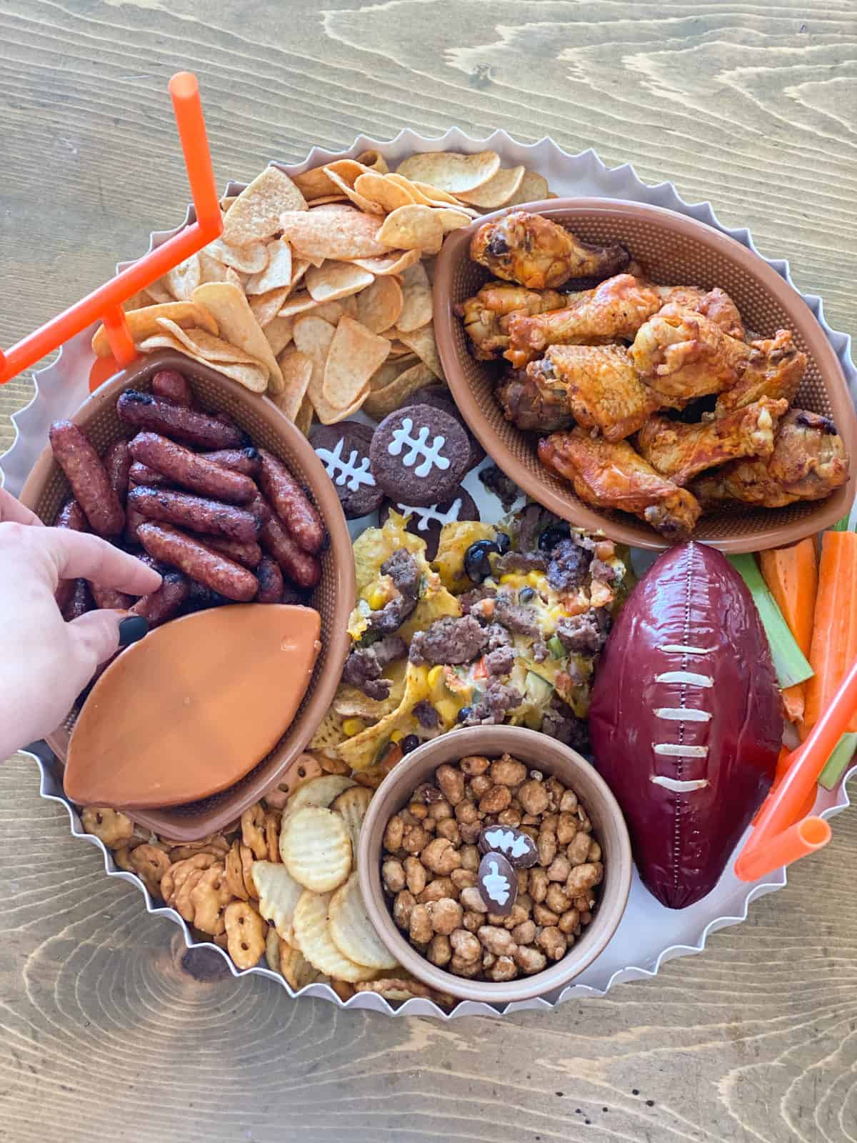 Super Bowl charcuterie board with football summer sausage and more