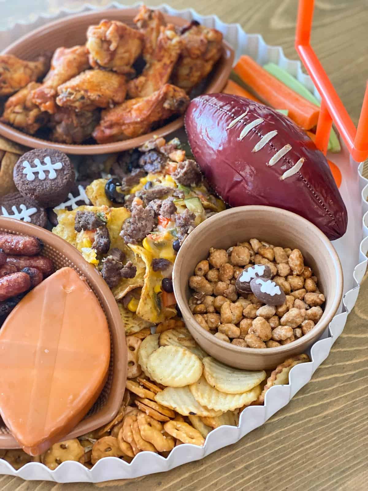 Super Bowl charcuterie board with football summer sausage and more