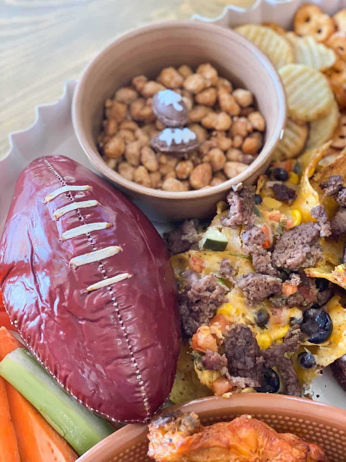 Super Bowl charcuterie board with football summer sausage and more