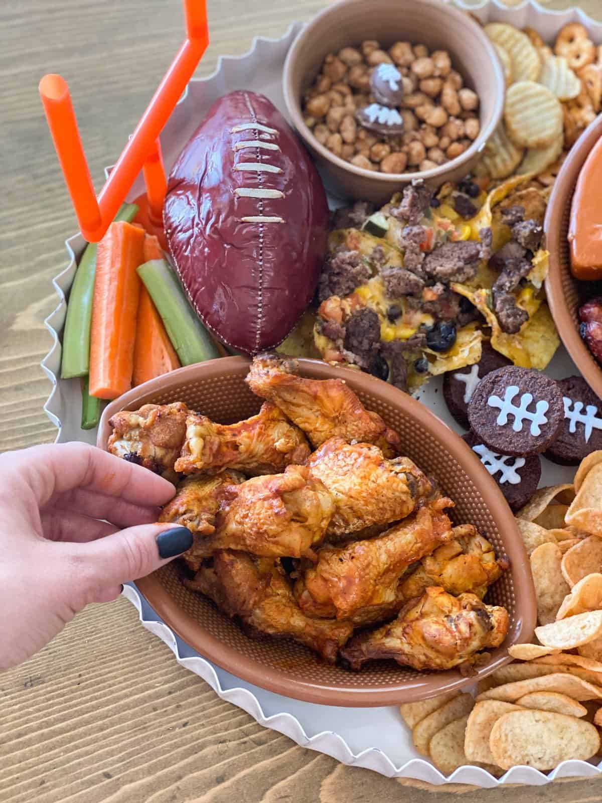 Super Bowl charcuterie board with football summer sausage and more