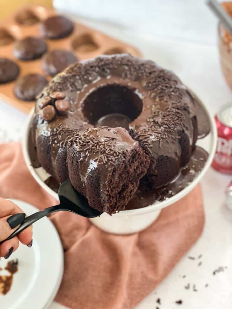 Dr Pepper Cake with a slice coming out on a pie utensil