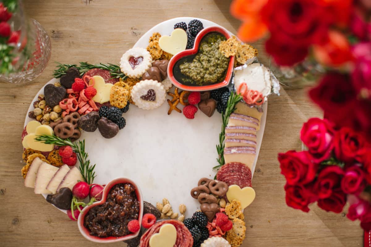 Valentines charcuterie board marble heart with crackers, cheese and salami