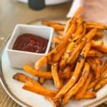 Frozen Sweet Potato Fries in Air Fryer on a plate with ketchup