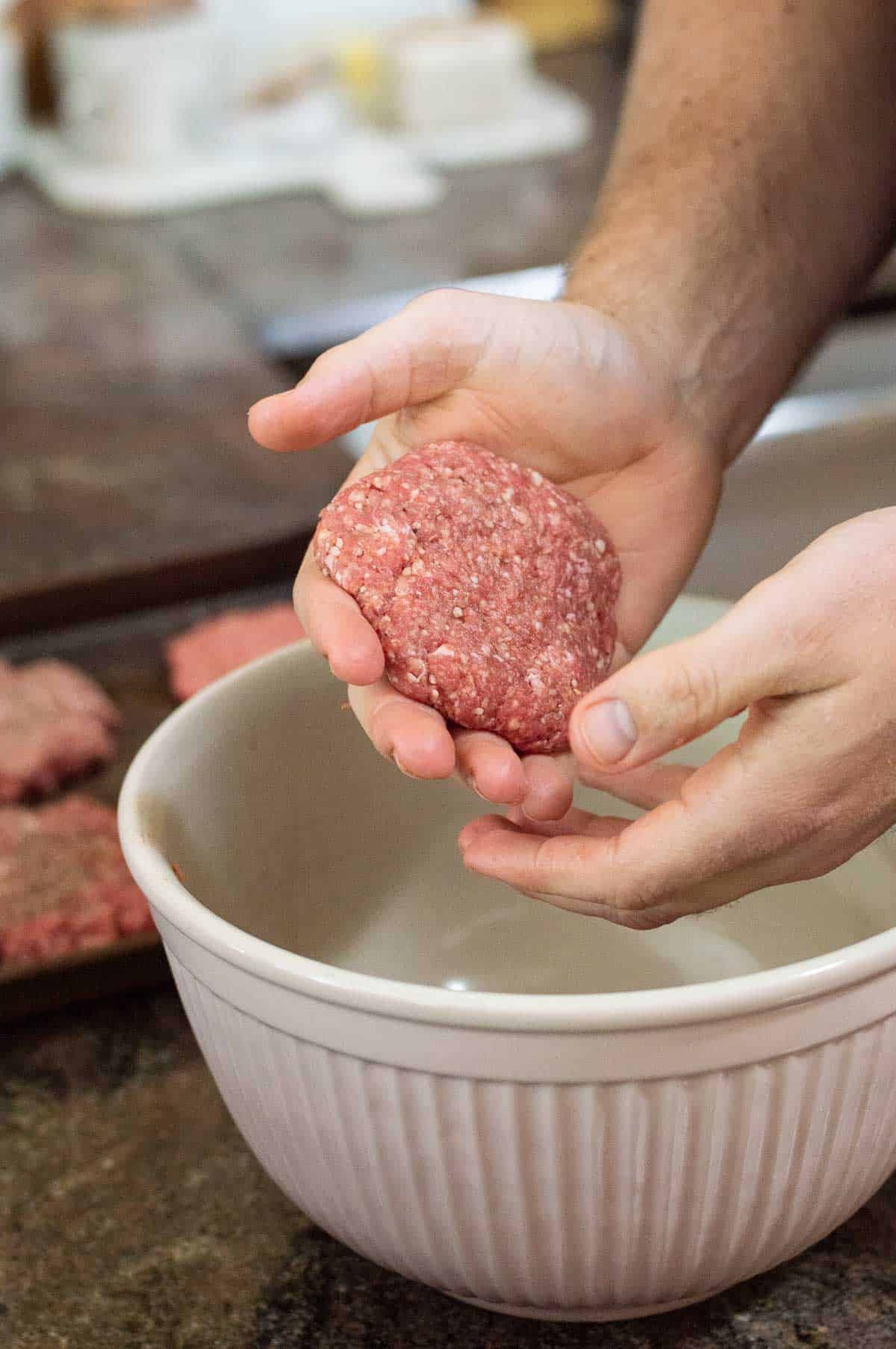 hand with ground beef