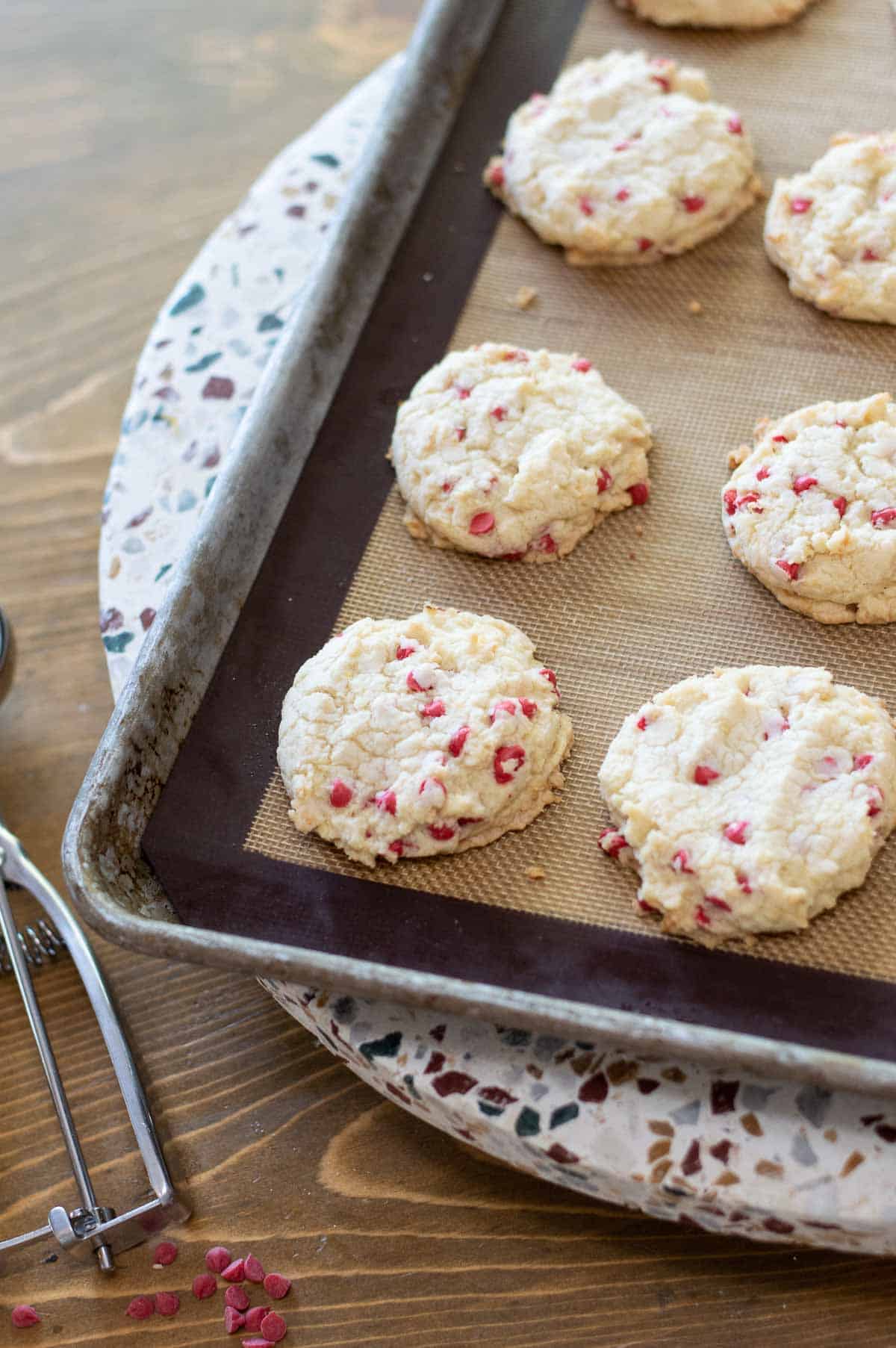 cherry chip cookies on a baking sheet