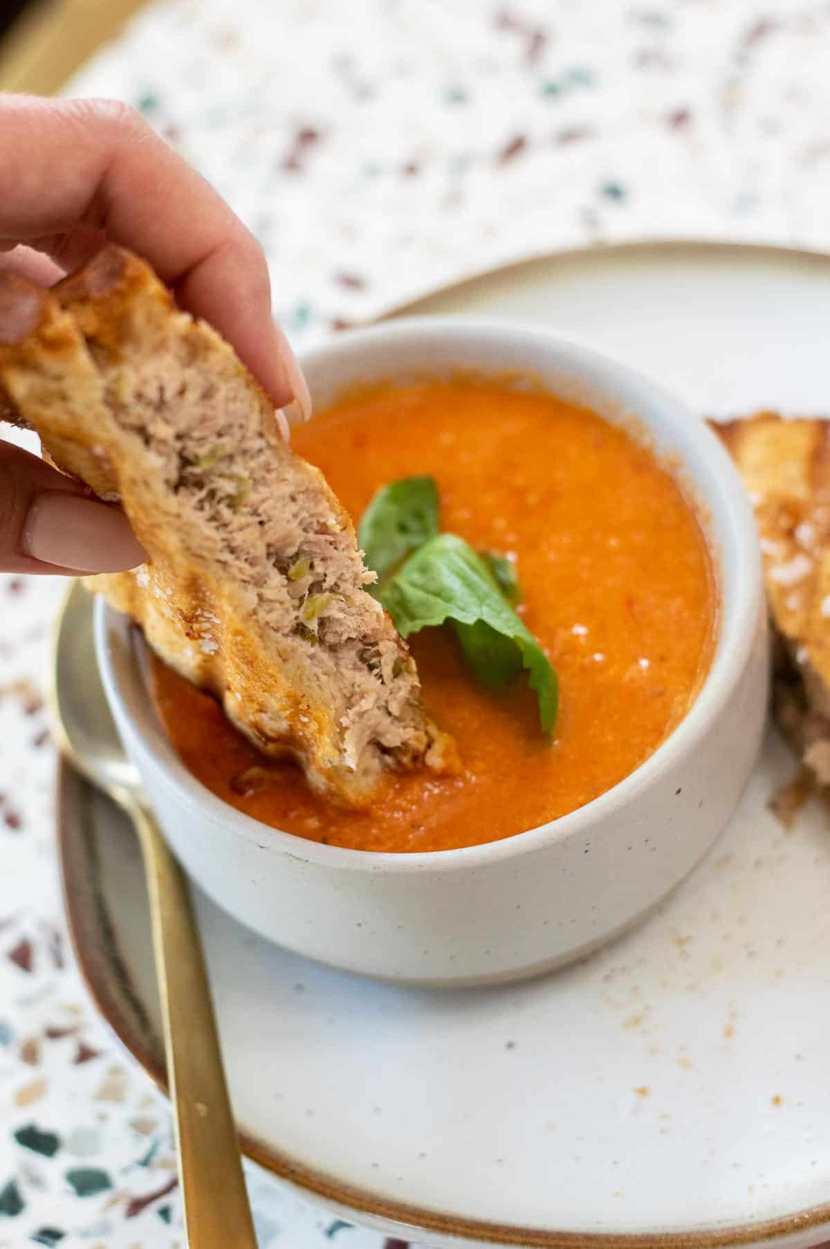 Dairy Free Tomato Soup with sandwich dipping in