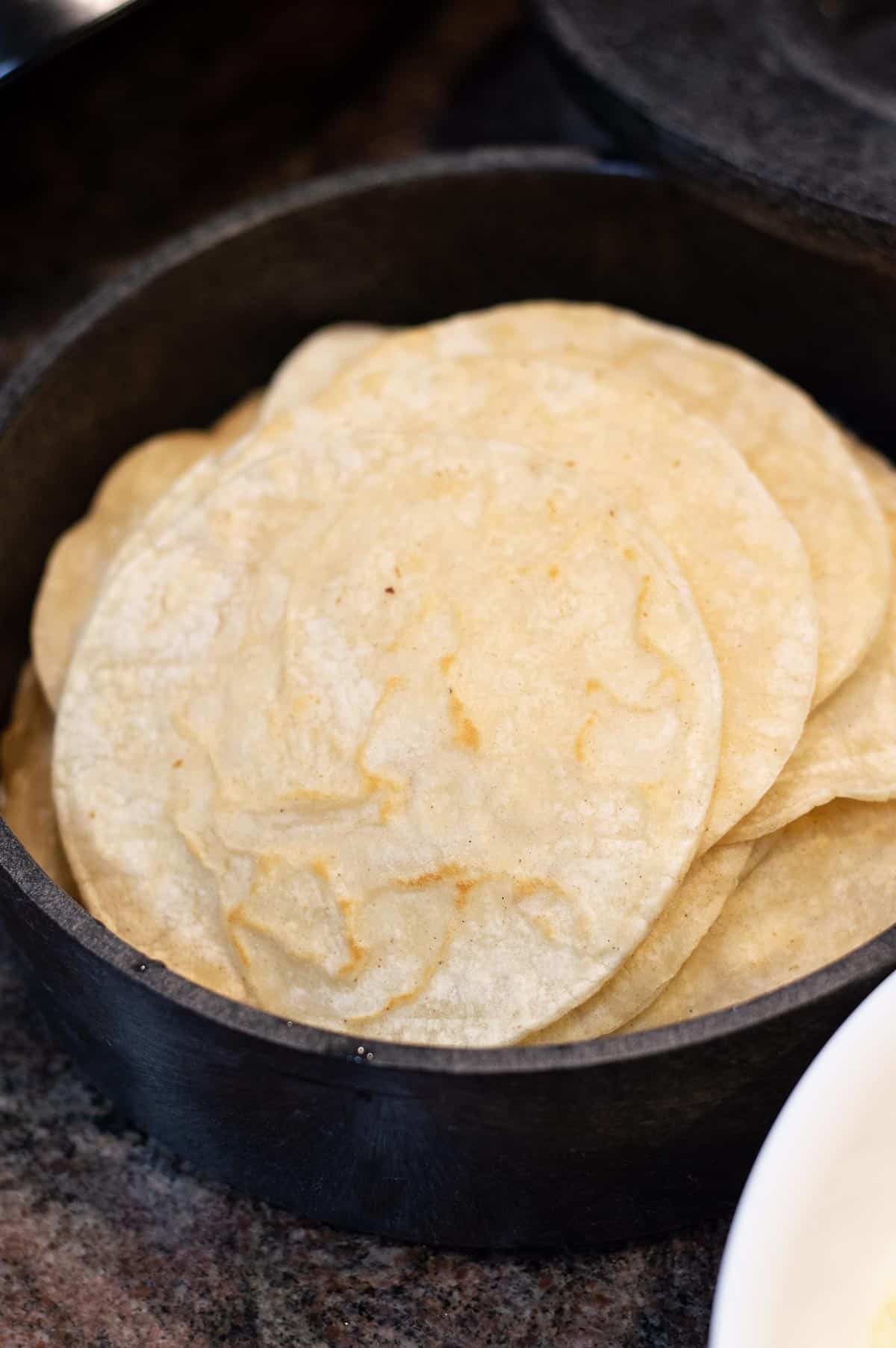 corn tortillas in a warmer