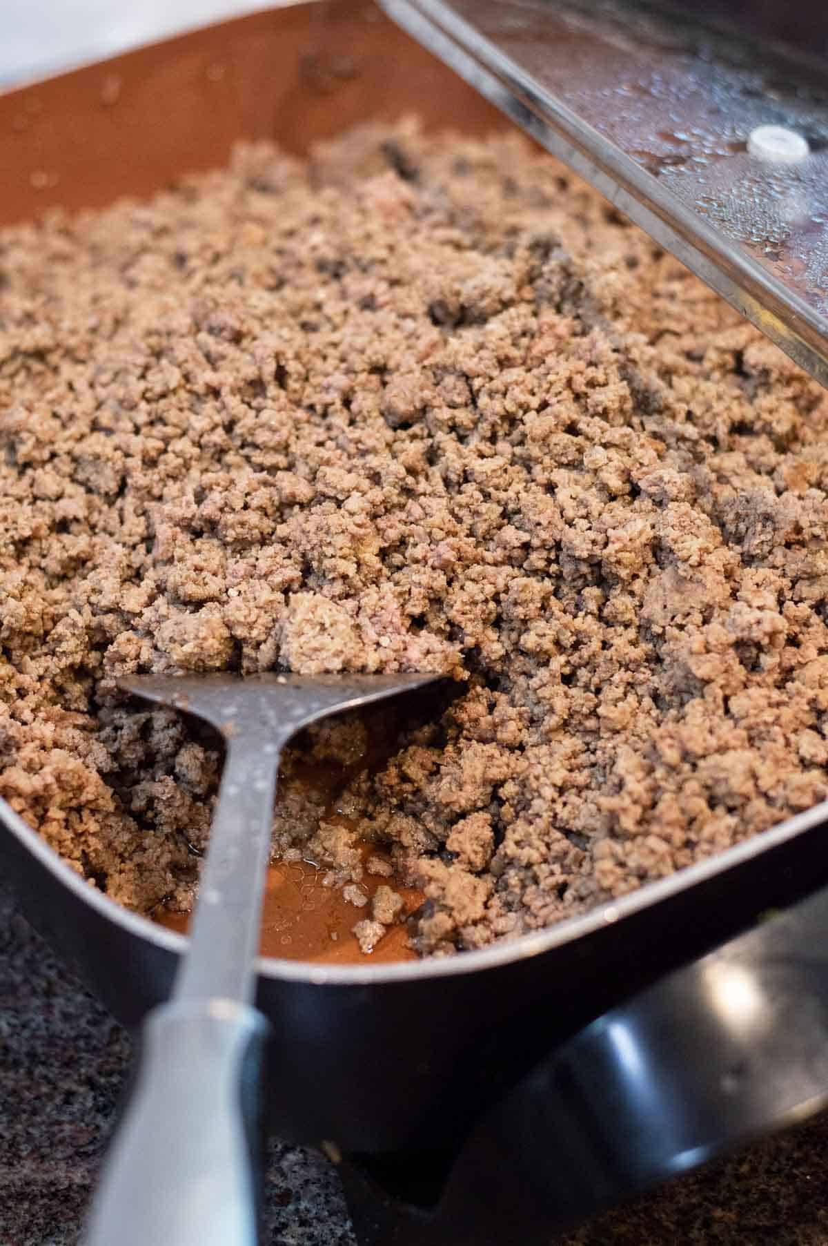 ground beef in a large frying pan 