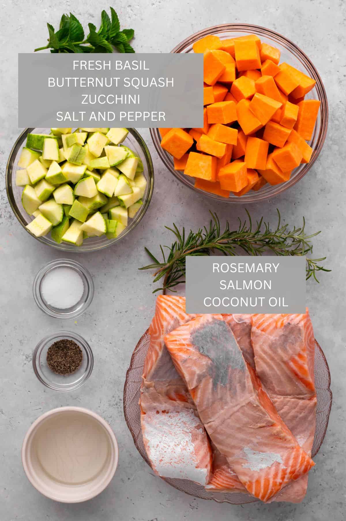 Sheet pan salmon and veggies ingredients in bowls and on a counter