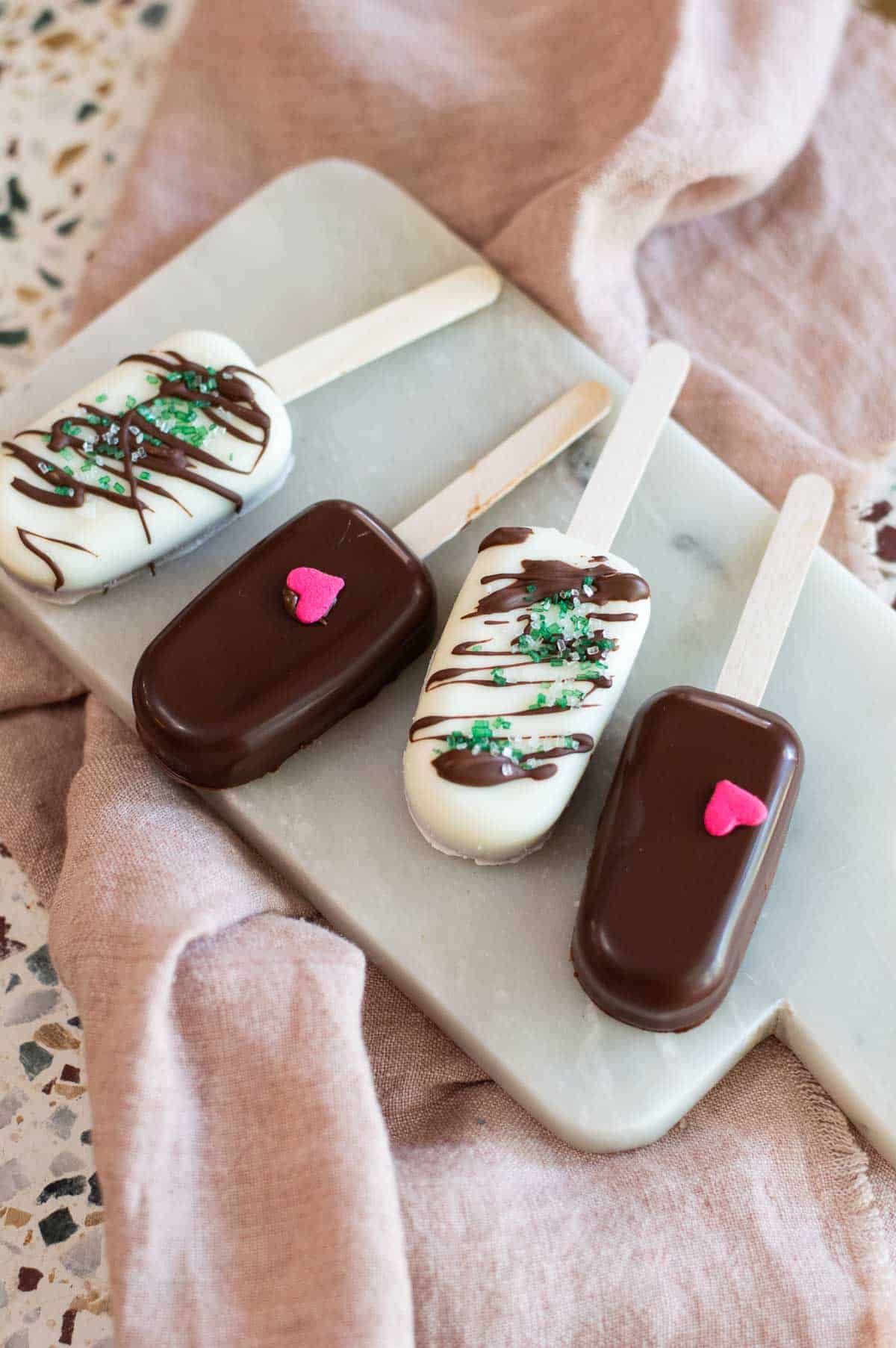 Cakesicles on a marble plate