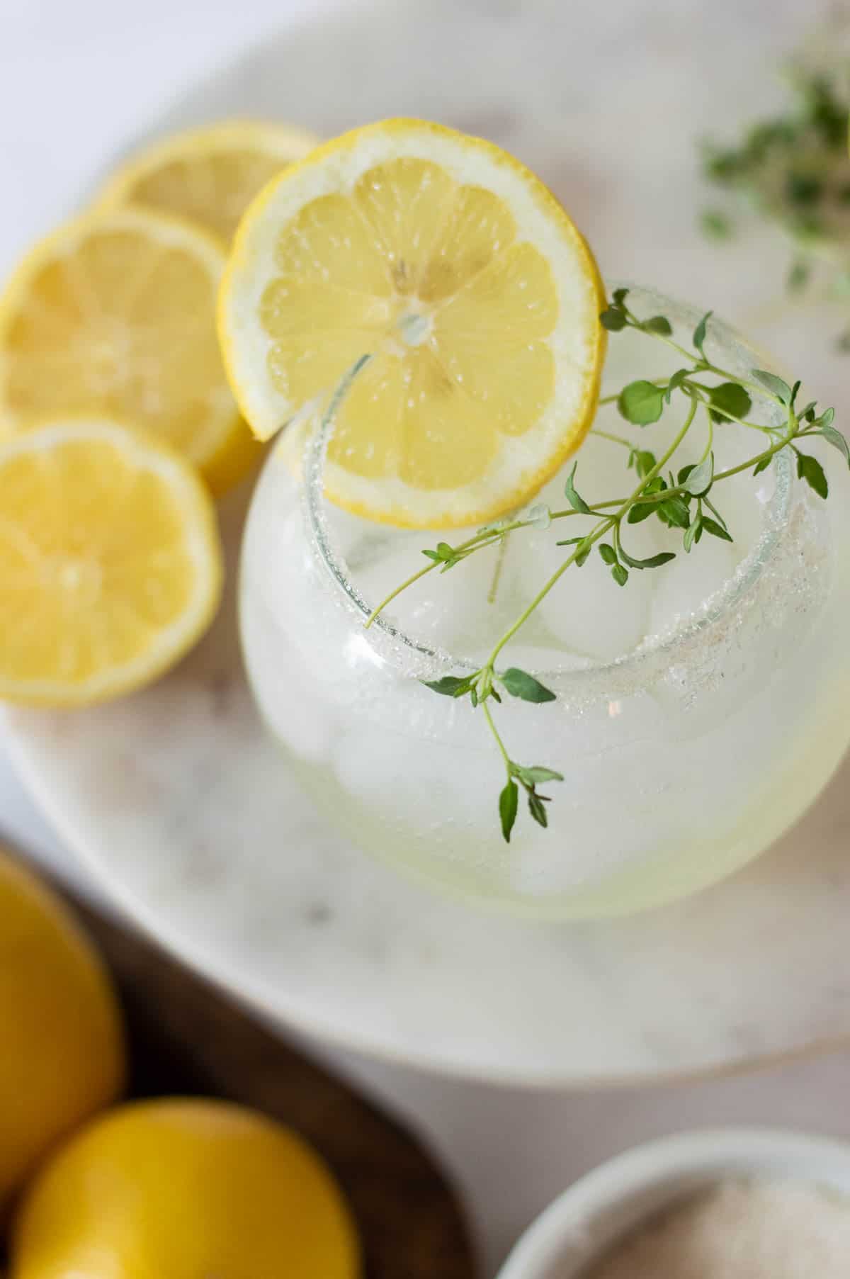 Lemon Mocktail in a glass with thyme