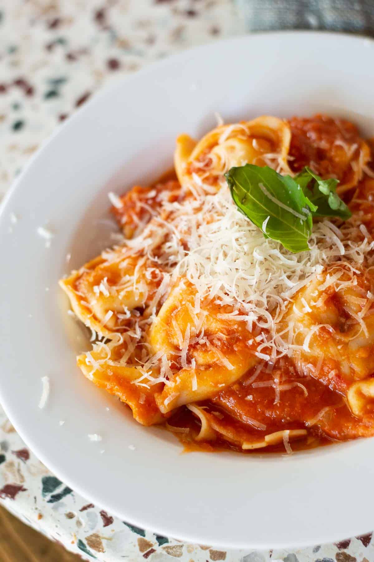 Tortellini Pomodoro is one of my favorite dinner recipes for a busy weeknight. Thi restaurant quality tortellini topped with homemade Pomodoro sauce is made in no time. 